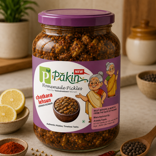 Jar of Pakin Homemade Pickles with a purple lid on a table with ingredients
